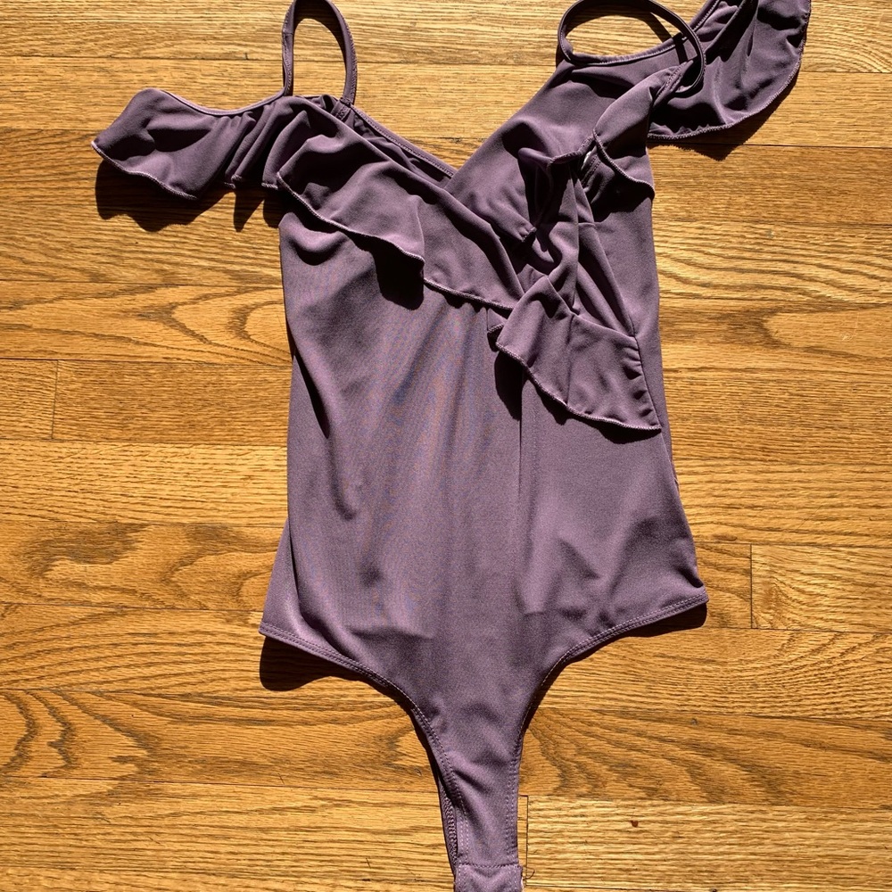 Purple ruffle off the shoulder bodysuit